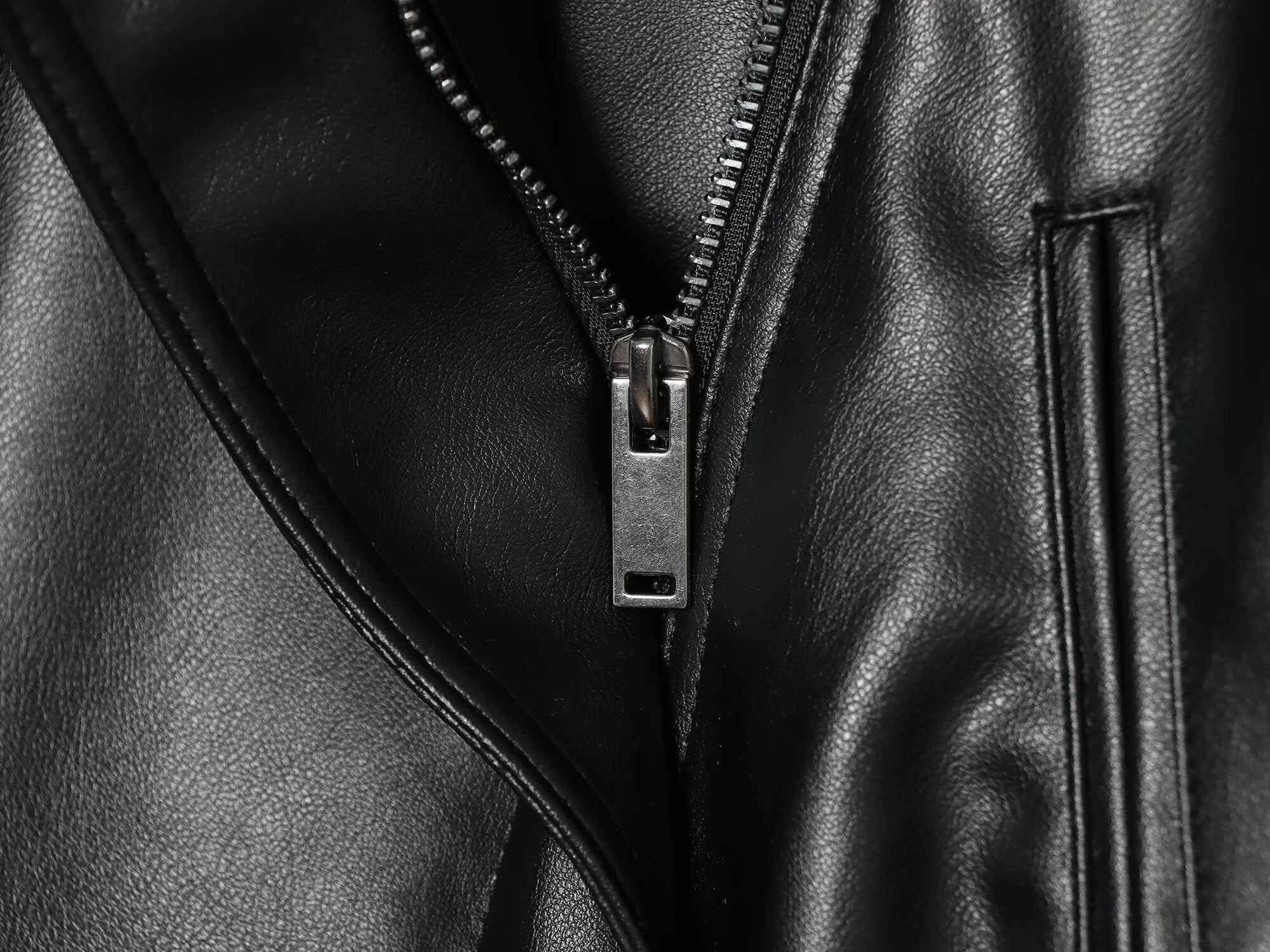Women's long sleeved lapel leather effect jacket