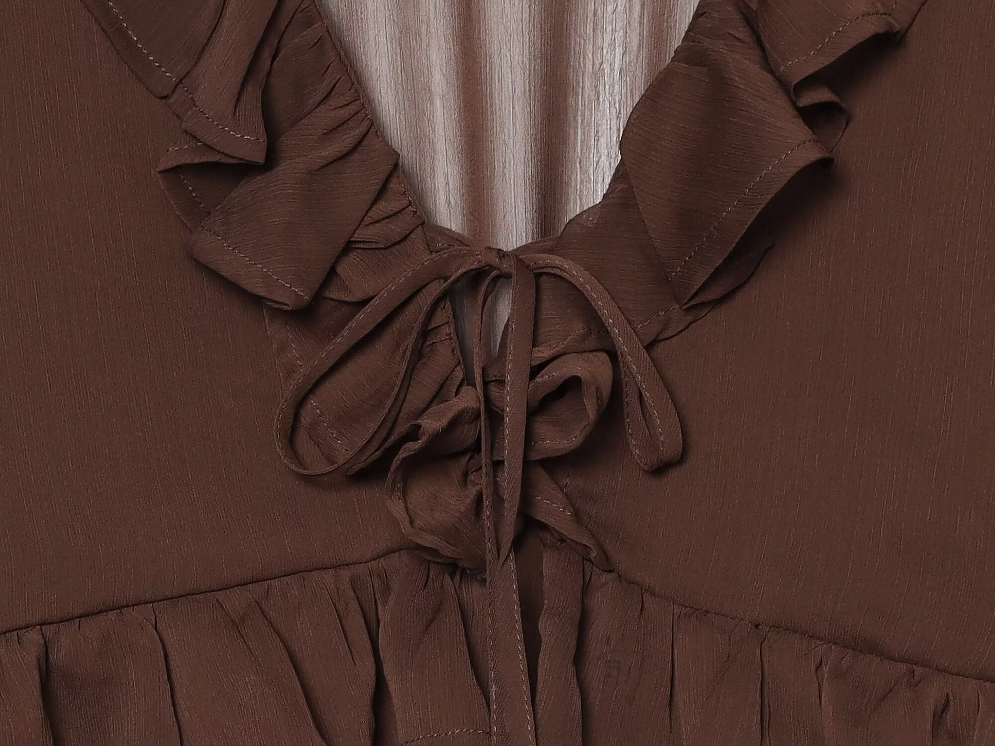 Women's slightly transparent ruffled V-neck top