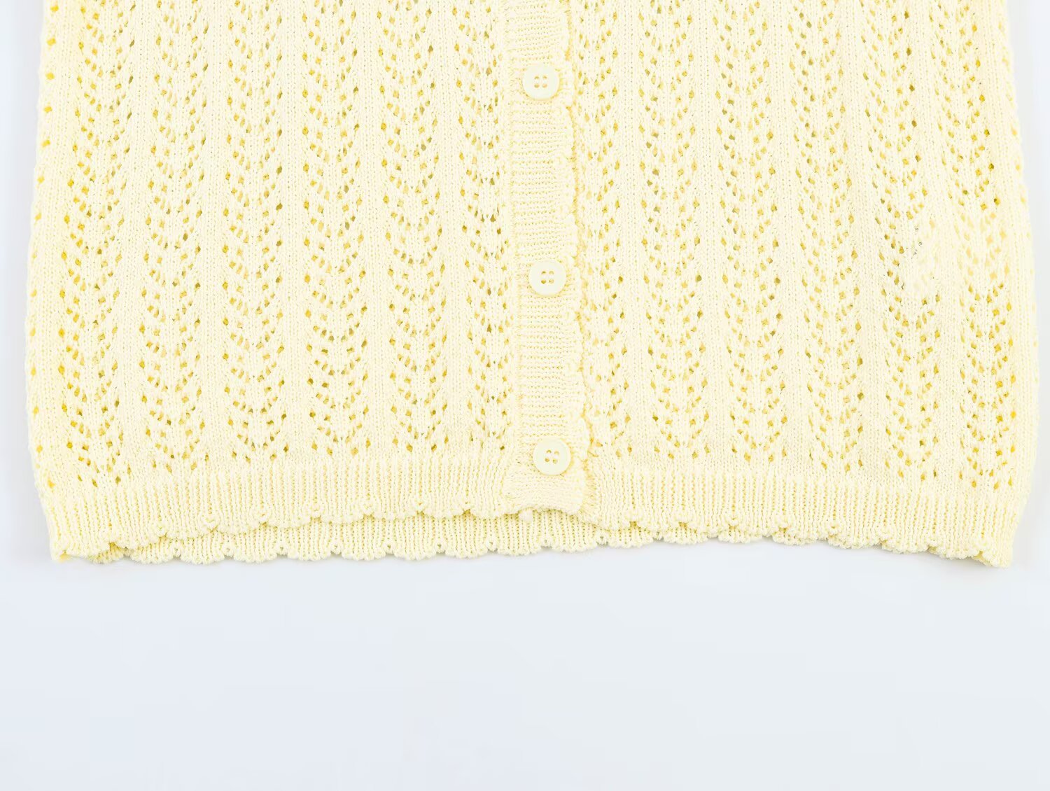 Women's short sleeved hollow knitted cardigan