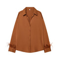 Women's feather decorated lapel satin textured shirt